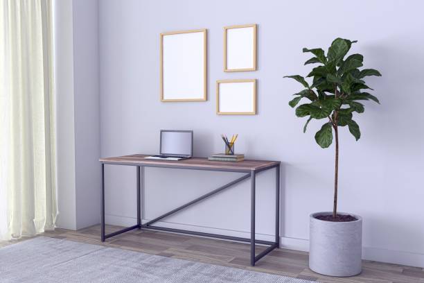 istock View of a working desk with a laptop and different objects in a gray-walled room - 3D rendering 1441565093