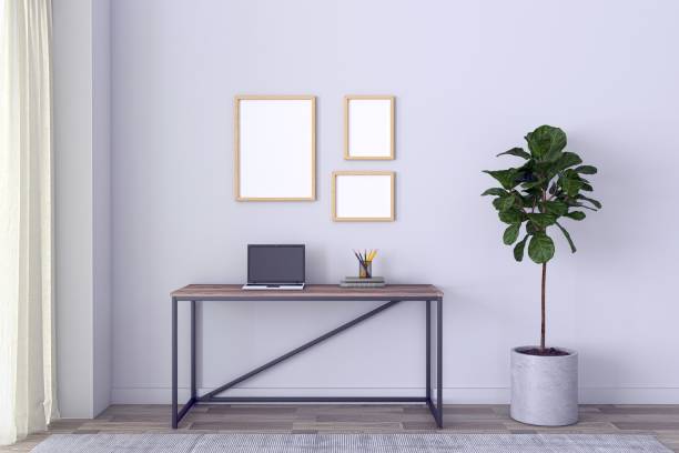 istock View of a working desk with a laptop and different objects in a gray-walled room - 3D rendering 1441565096