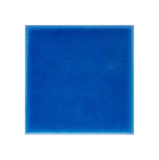 istock Closeup shot of a blue ceramic tile surface isolated on a white background 1441565579