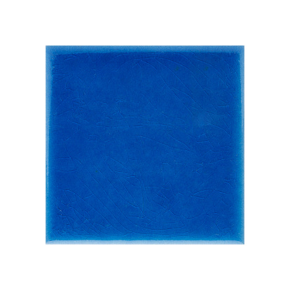 A closeup shot of a blue ceramic tile surface isolated on a white background