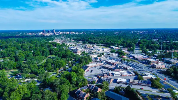 An aerial view of Greensboro's cityscape with traffic on Battleground Ave