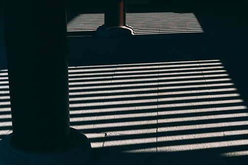 Symmetric horizontal shadows on the floor