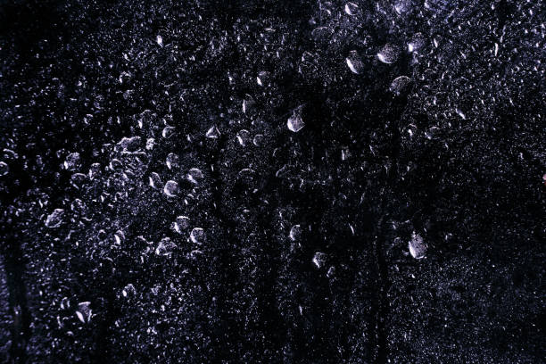 Water drops on a cristal surface with a dark background Water drops on a cristal surface, perfect to use for compositing. photoshop texture stock pictures, royalty-free photos & images