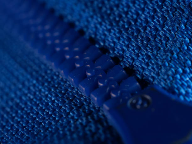 Blue leather texture and open metal zipper isolated on white background. Business background, banner, header, mockup with copy space. Top view, flat lay. Sale, shopping, discount concept