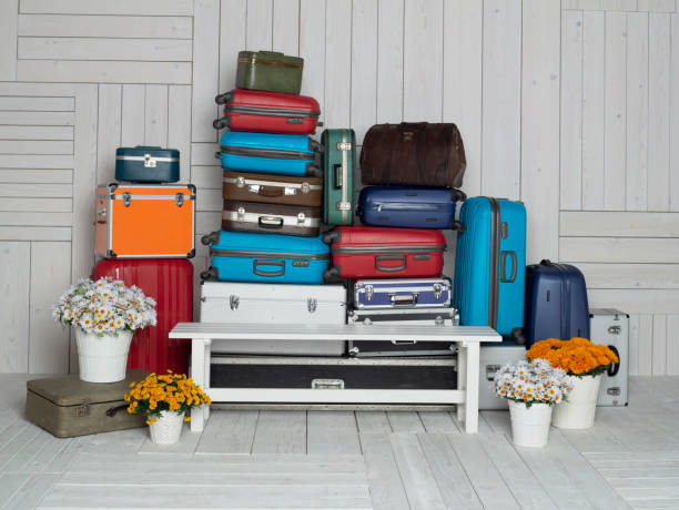 istock Suitcases multicolor stacked for transport one above the other 1441568757