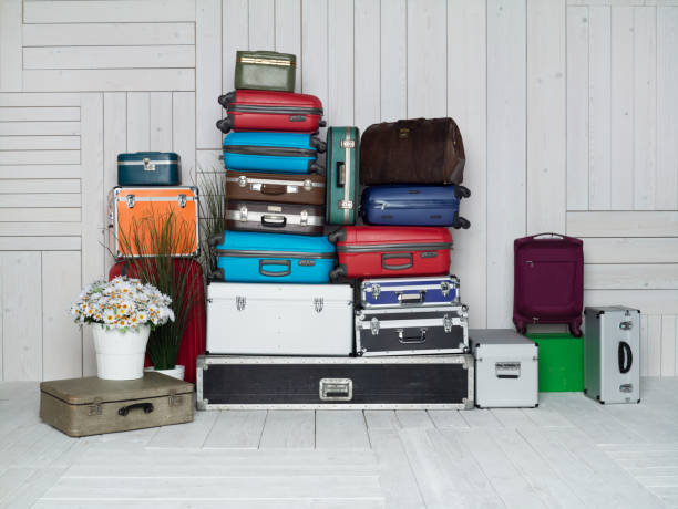 istock Suitcases multicolor stacked for transport one above the other 1441569207