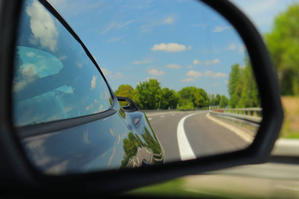 istock Look back through side mirror of sportscar 1441569414