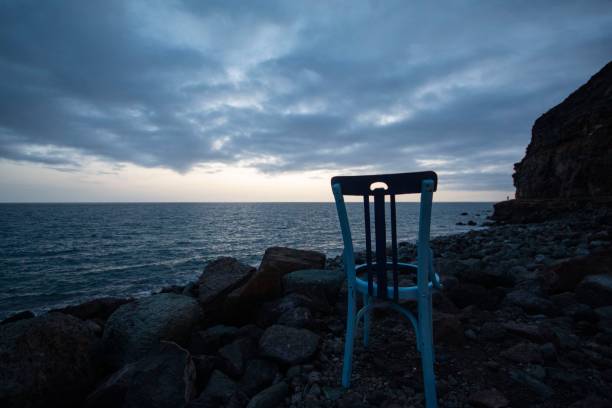 istock Lonely chair looking towards the infinity. 1441570357