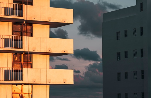 An outdoot view of a modern building in a city during sunset