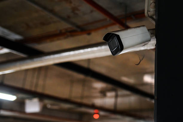 istock Close-up shot of a security camera underground garage 1441570763