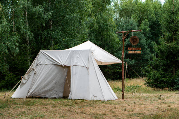 istock View of a white tent in a forest 1441571015