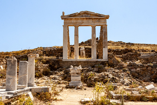 A daylight shot of the Greek ruins of the archaeological site of Delos Island, Greece