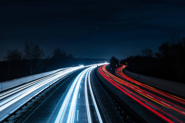 istock Closeup of a long exposure road at night 1441571998