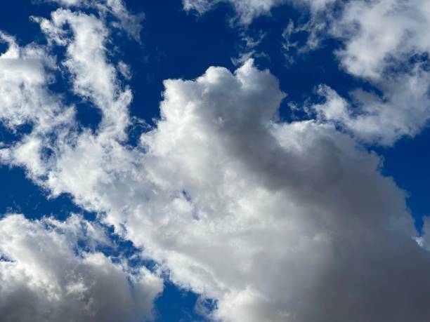 istock Low angle shot of a blue sky with clouds 1441572657