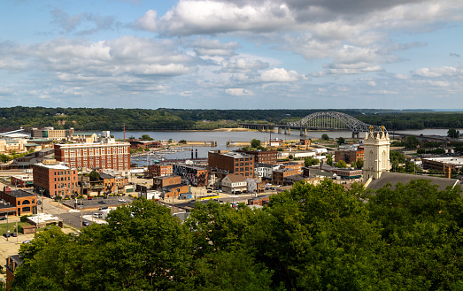 An aerial view of the city of Dubuque against a blue cloudy sky on a sunny day, Iowa, United States
