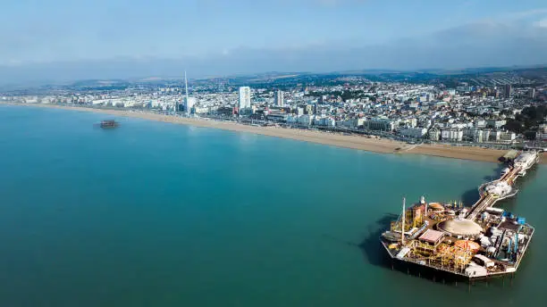 An aerial view of the Brighton West Pier in Brighton, England on blue sky background