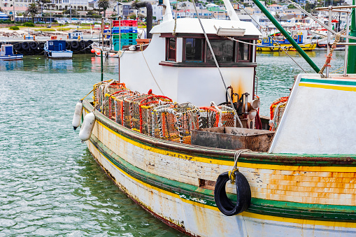 Crayfish Crab boat floating in Kalk Bay Harbour, Cape Town
