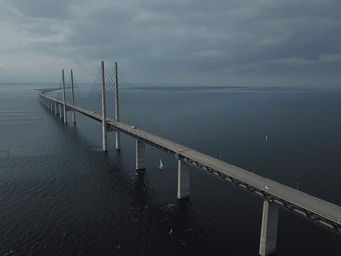 Aerial view of the bridge across the Oresund strait between Denmark and Sweden on a cloudy day