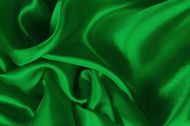 istock Green fabric texture background, detail of silk or linen pattern. 1441579680