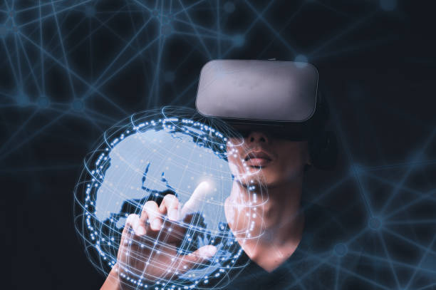 istock Businessman using VR glasses to check a holographic globe diagram 1441579712