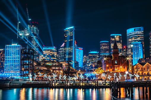 A beautiful view of the cityscape of Sydney with illuminated buildings in Australia at night