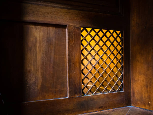 closeup of a wooden window of the confessional box at church - confession booth imagens e fotografias de stock