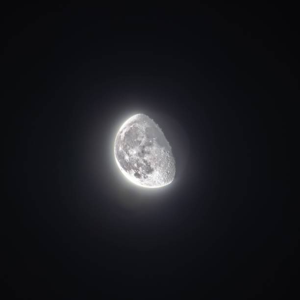 istock Bright half moon in the night sky 1441582916
