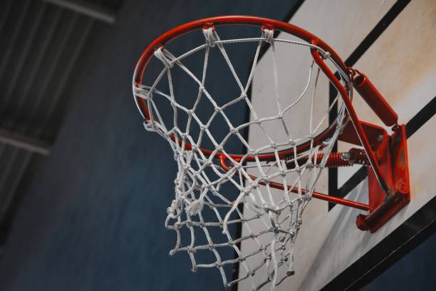 istock Low angle shot of basketball ring with net 1441582936