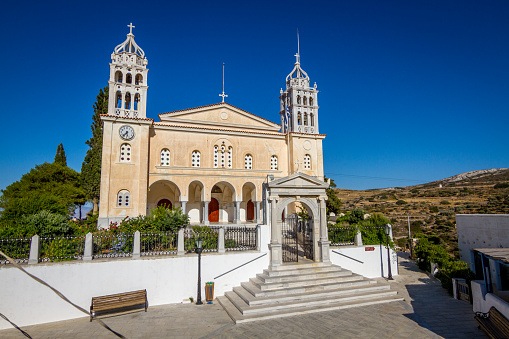 A beautiful view of the Agia Triada, a Greek Orthodox church against a blue sunny sky