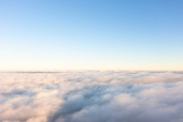 istock Aerial view white clouds in blue sky. View from drone. Aerial top view cloudscape. Texture of clouds. View from above. Panorama sky 1441583366
