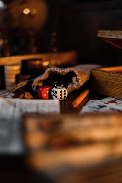 istock Playing cards with game dices and pencil on a table 1441583503