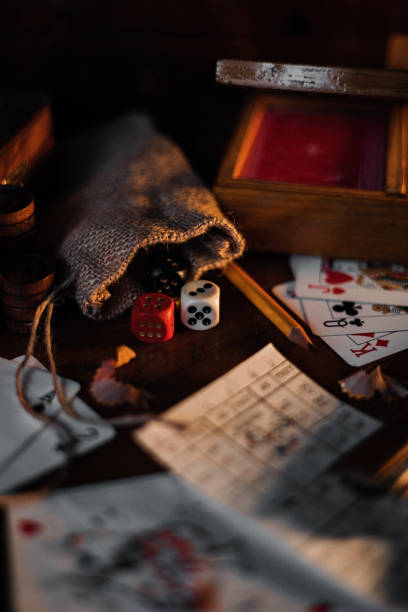 istock Playing cards with game dices and pencil on a table 1441583504