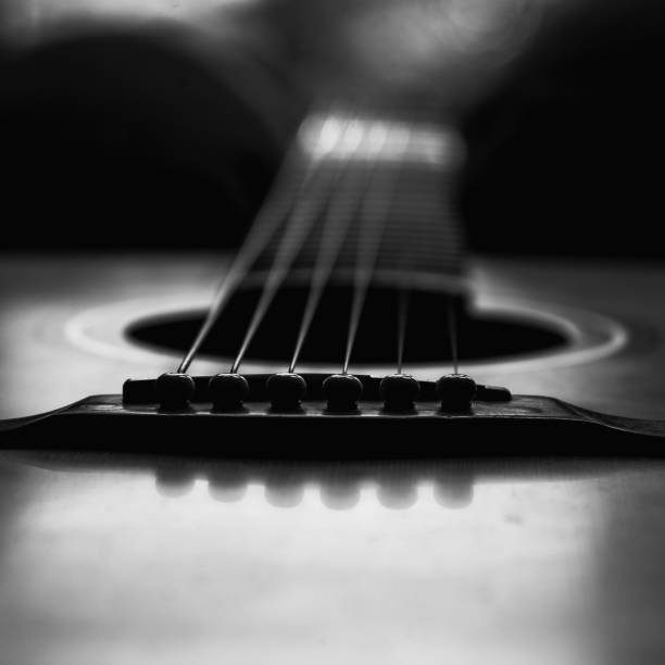 istock Grayscale macro shot of a guitar 1441583592