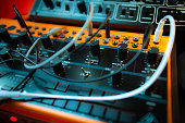 Closeup shot of a Behringer analog semi-modular synthesizer