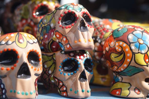 istock Closeup of decorative skulls with colorful patterns on a shelf 1441583778