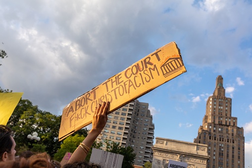 New York City, United States – June 25, 2022: A crowd of protesters holding cardboard signs after Supreme Court overturned Roe v. Wade
