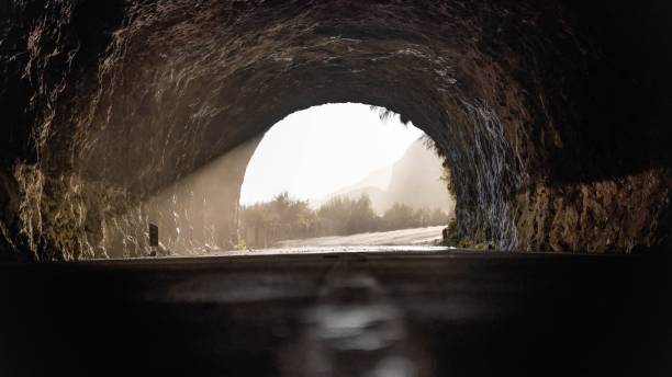 istock Old tunnel with sunlight leaking into it at golden hour 1441584024