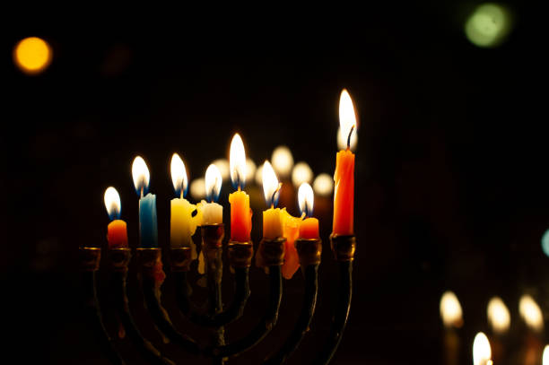 istock Colorful wax candles melting on a Hanukkah menorah 1441585182