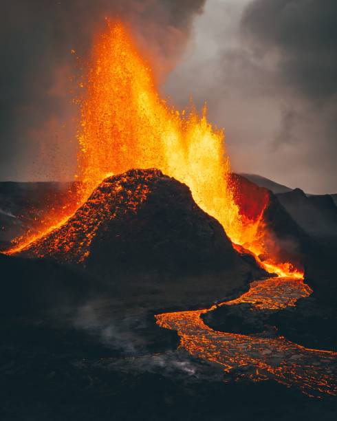 istock Vertical shot of exploding burning lava near a volcano 1441585418