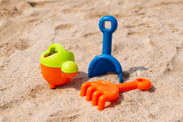 istock Plastic scoop, rake and watering can for playing on the beach 1441589472