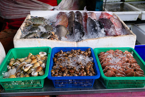 Market stall selling seafood delicacies in Thailand