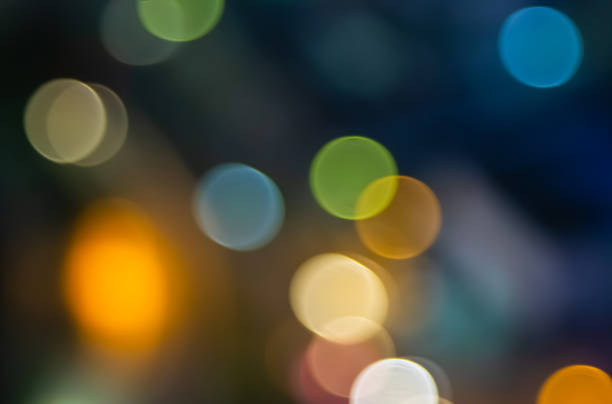 istock Abstract city lights blur blinking background. Soft focus horizontal long banner. Bokeh sparkles colorful defocused on dark texture for night party city. Abstract blurred pattern template. 1441589729