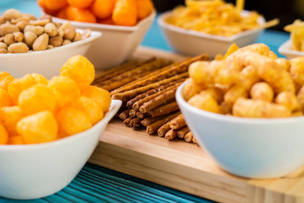 Salty snacks served as party food in bowls