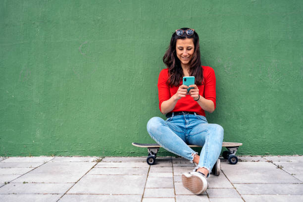 Skater Girl Using Phone