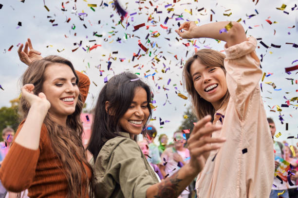 Group of friends have fun at the music festival stock photo