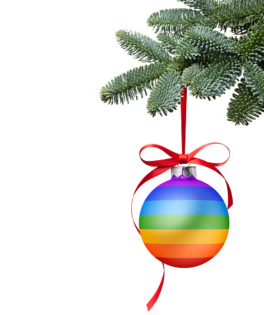 Christmas ball in the colors of the peace flag isolated on white background.
