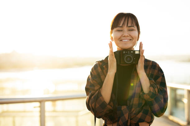 istock Attractive tourist with a camera 1441604770