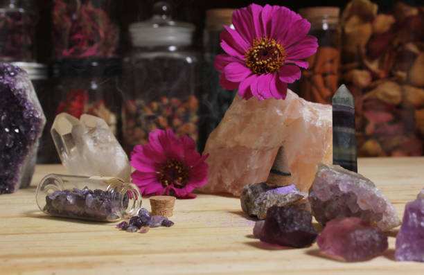 istock Amethyst Crystals With Flowers and Incense Cone on Meditation Table 1441605099