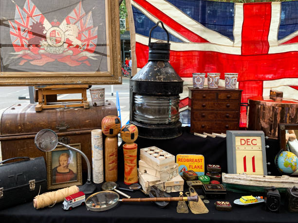 Flea market at Chiswick High Road in Chiswick, West London, England, UK. Collection of Items, including old painting, lantern, British flag, old ceramic things in a London's antique shop. Vintage market