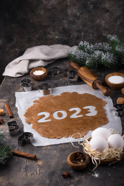 istock Gingerbread dough for cookies in shape of 2023 1441609721